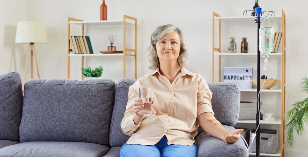 Healthcare provider preparing a Myers Cocktail IV drip infusion for a wellness patient
