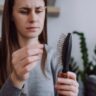 Stress-related hair shedding shown with visible thinning at the scalp