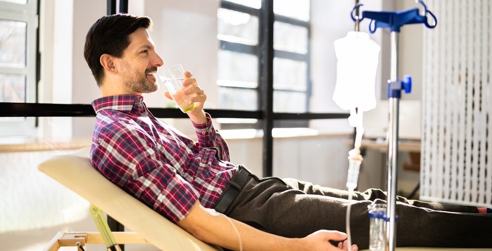 Patient relaxing during an IV hydration session at Drip Lounge and Wellness in Saraland AL