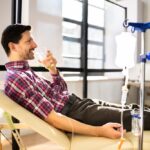 Patient relaxing during an IV hydration session at Drip Lounge and Wellness in Saraland AL