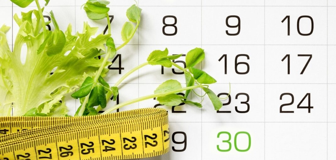 Calendar with measuring tape and greens representing the first month medical weight loss journey