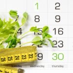 Calendar with measuring tape and greens representing the first month medical weight loss journey