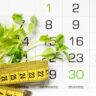Calendar with measuring tape and greens representing the first month medical weight loss journey
